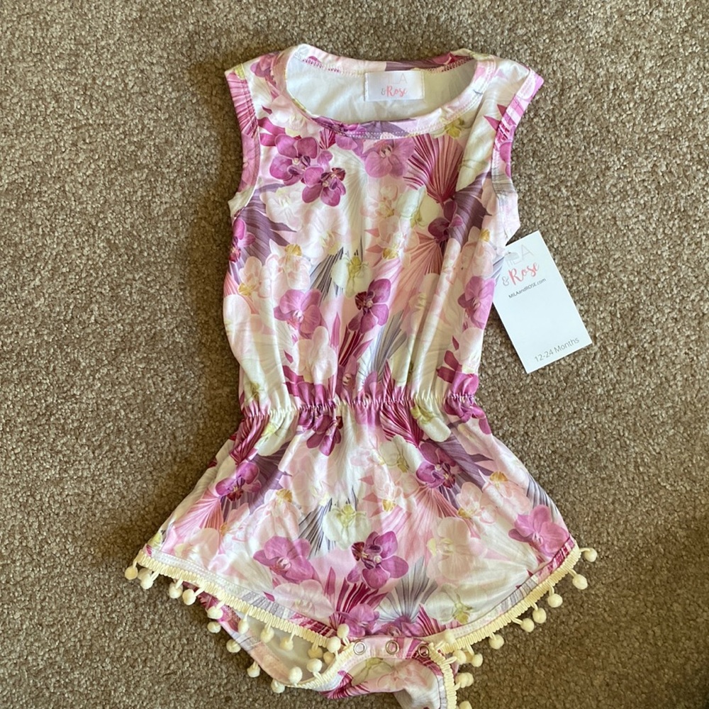 Floral romper with pom poms